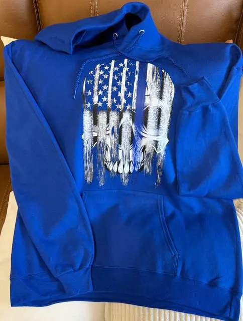 A blue hoodie with an american flag design on it.