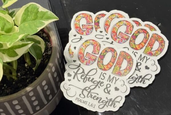 A close up of two stickers on top of a plant