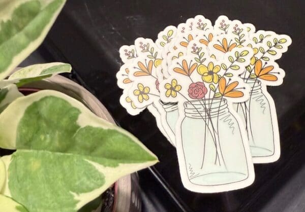 A close up of a sticker with flowers in it
