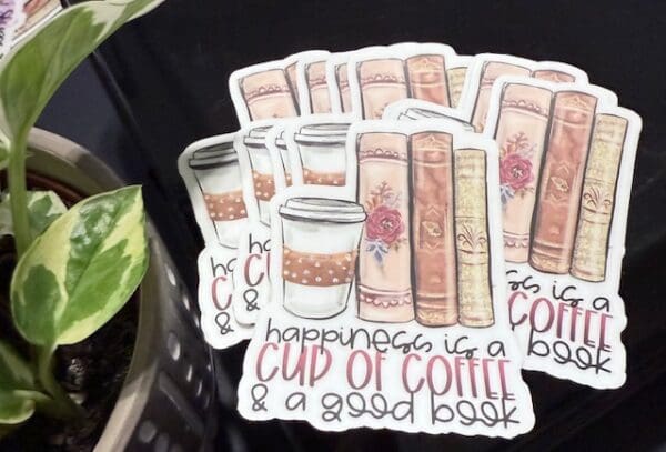 A bunch of stickers that are on top of some books.
