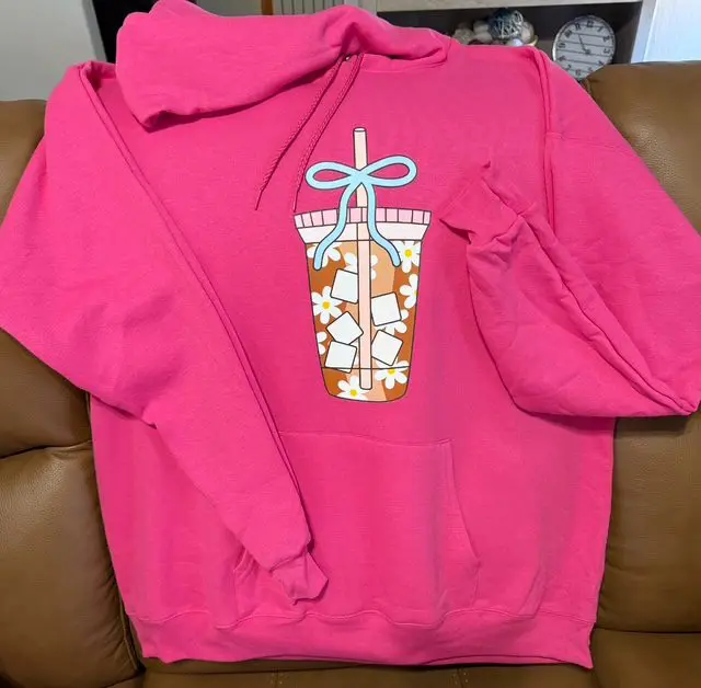 Pink hoodie with bubble tea illustration.