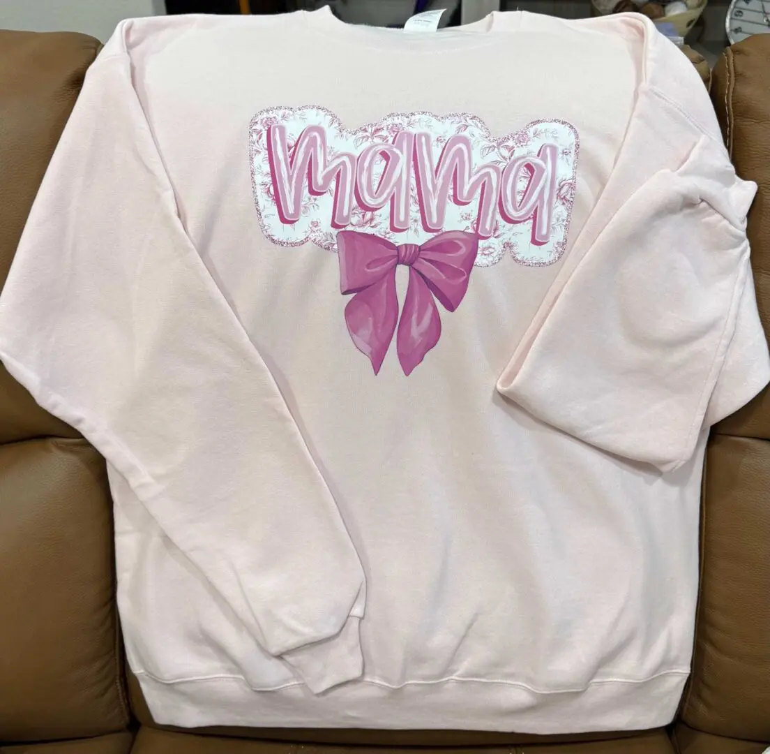 A sweatshirt with the word " mama " written on it.