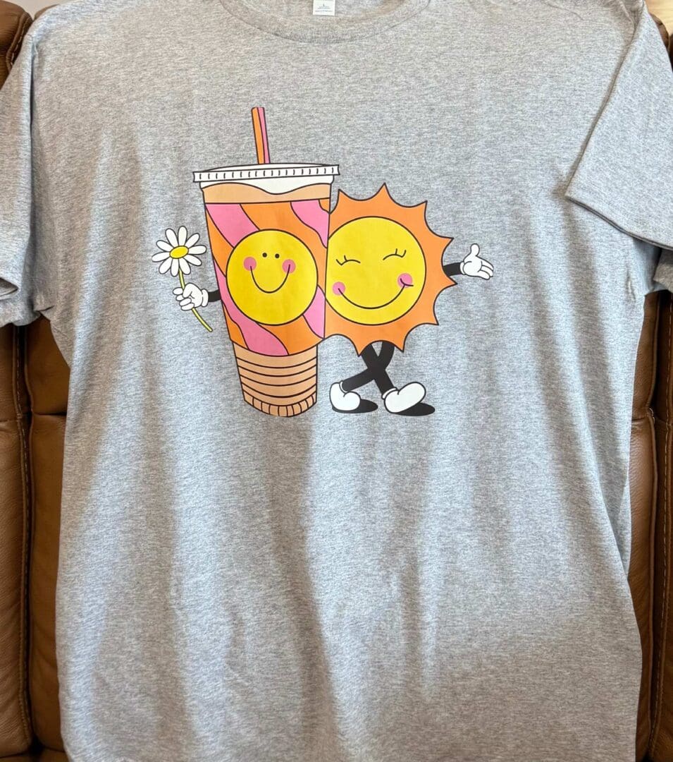 A gray t-shirt with two cartoon characters on it.