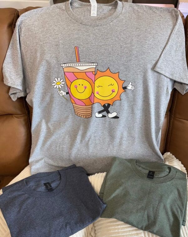 A couple of shirts that are on top of a couch