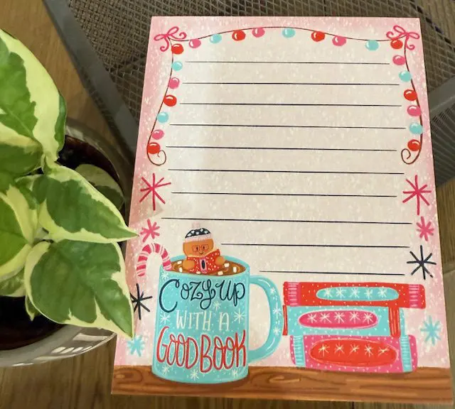 A note pad with a coffee pot and oven on it.