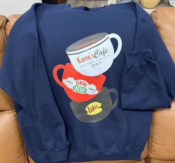 A sweatshirt with coffee cups on it