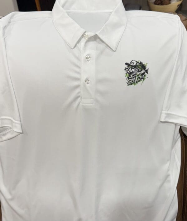 A white polo shirt with a black and silver logo.