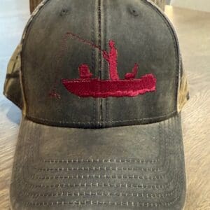 Cap with red embroidered fishing design.