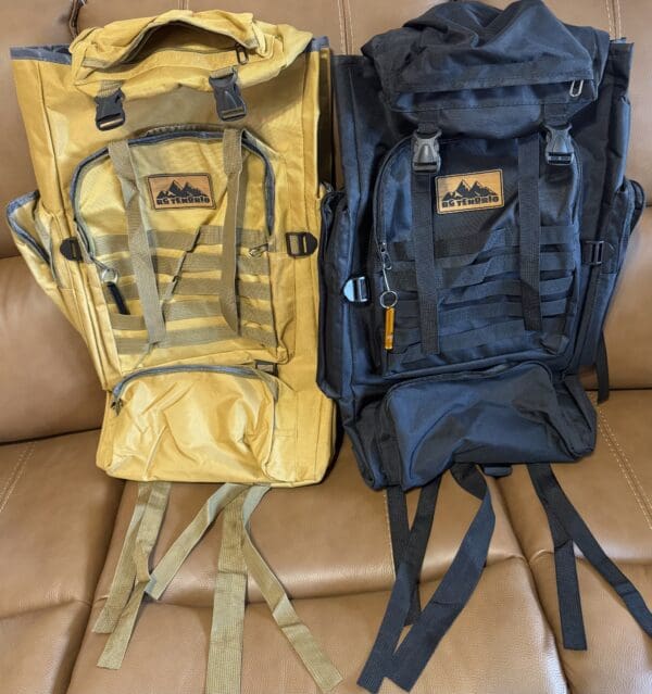 Two backpacks, one yellow, one black.