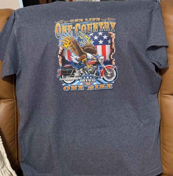 T-shirt with eagle, motorcycle, and flag design.