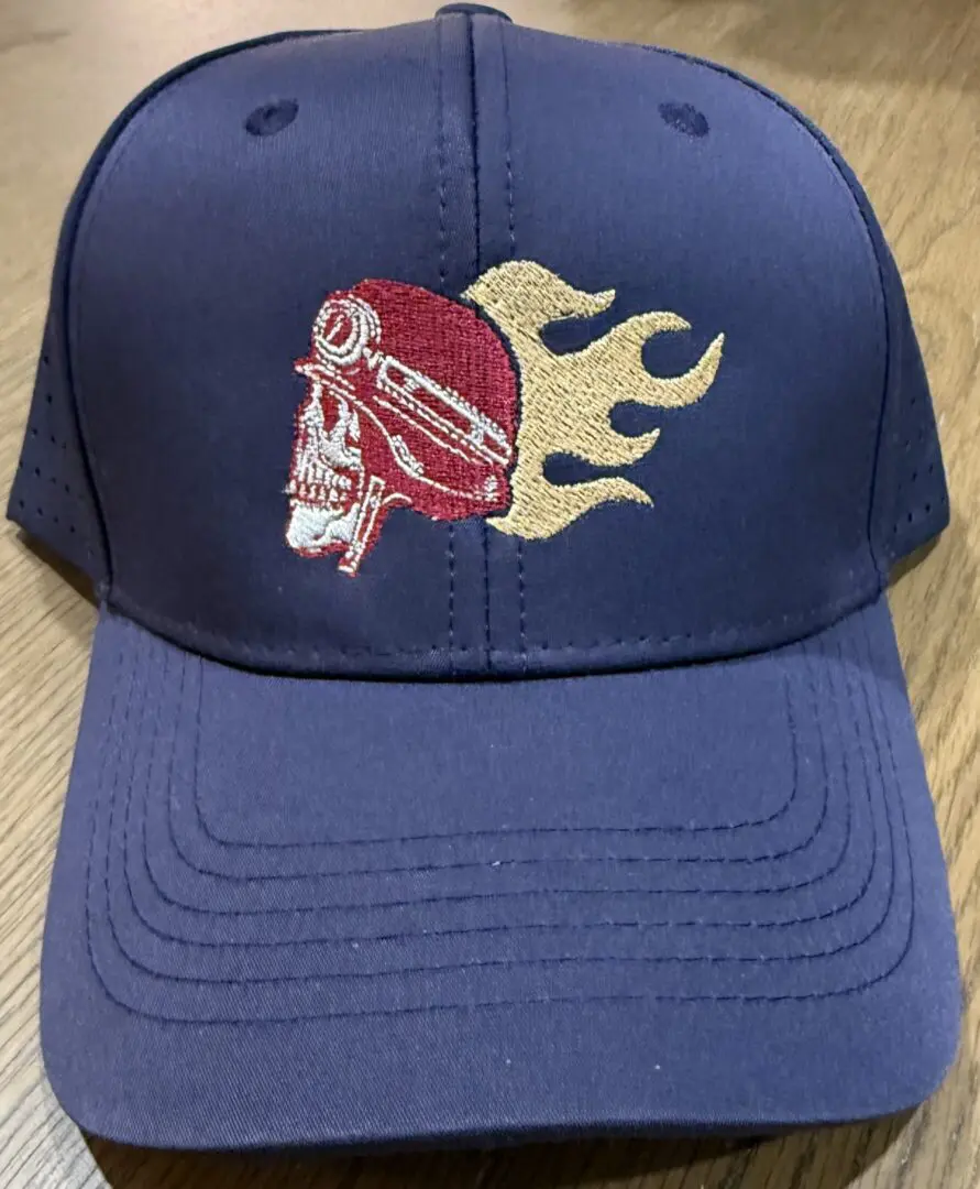 Baseball cap with flaming skull design.