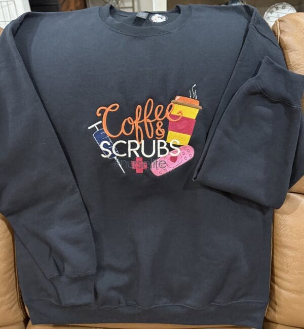 Sweatshirt with "Coffee & Scrubs" embroidery design.
