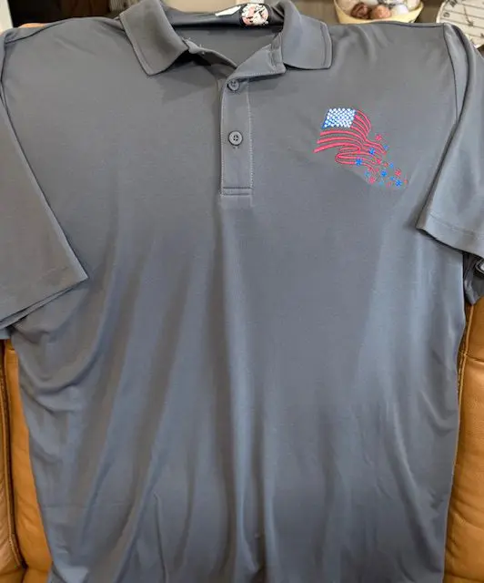 Gray polo shirt with American flag design.