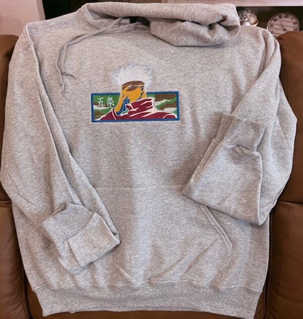 Gray hoodie with colorful front design.