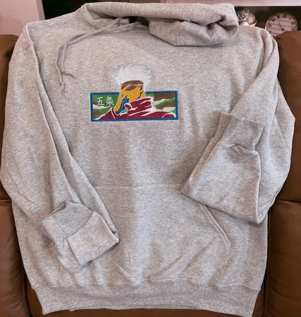 Gray hoodie with colorful front design.