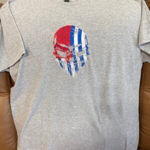 Gray shirt with American flag skull design.