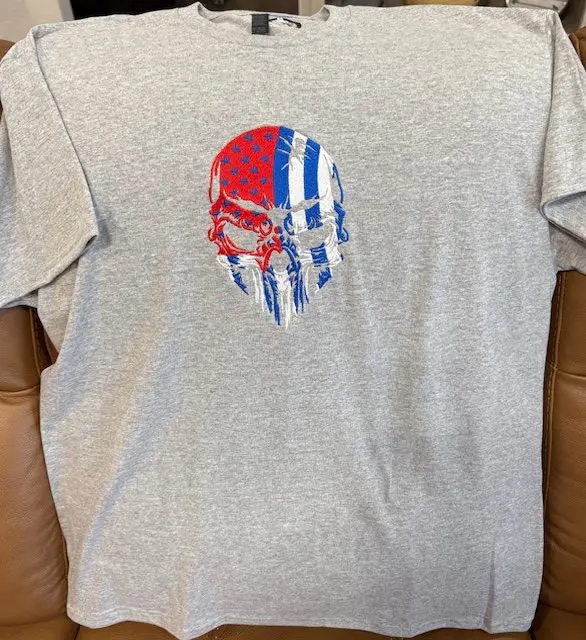 Gray shirt with American flag skull design.