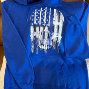 Blue hoodie with American flag skull design.