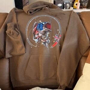Brown hoodie with fish graphic design.