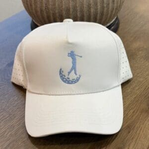 White cap with golf swing embroidery.