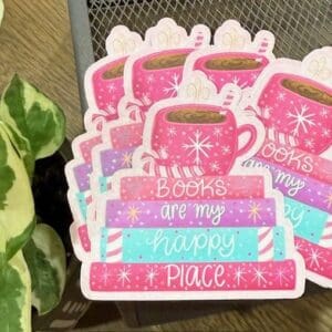 Stickers with mugs, books, and plant.