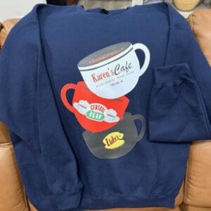 Sweatshirt with stacked coffee cup design.