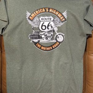 Green T-shirt with Route 66 motorcycle design.