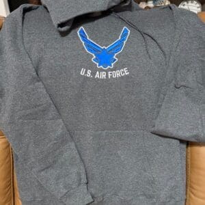 Gray U.S. Air Force hoodie on chair.