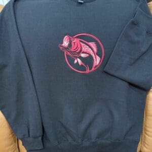 Black sweatshirt with red fish design.