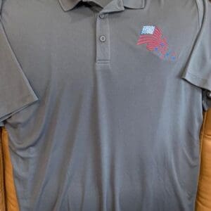 Gray polo shirt with American flag design.