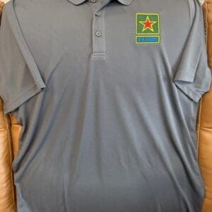 Gray polo shirt with US Army patch.
