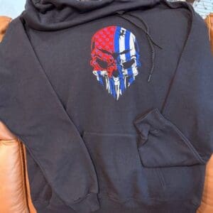 Black hoodie with skull and flag design.