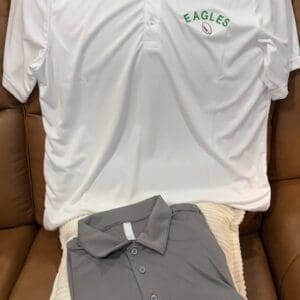 White and gray polo shirts on display.