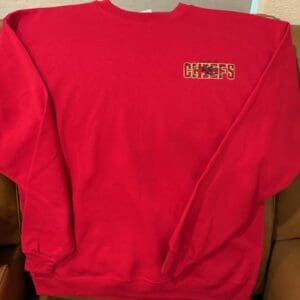 Red Chiefs sweatshirt on a couch.