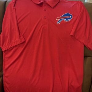 Red polo shirt with blue buffalo logo.