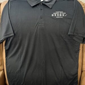 Black polo shirt with "Armor of God" design.