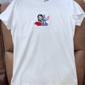 White T-shirt with cartoon character design.