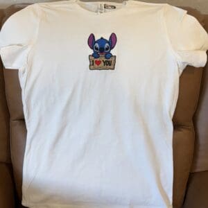 White T-shirt with cartoon character print.