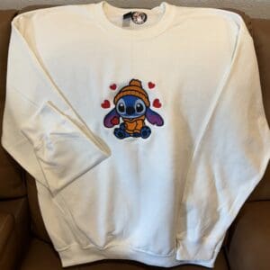 White sweatshirt with cute character design.