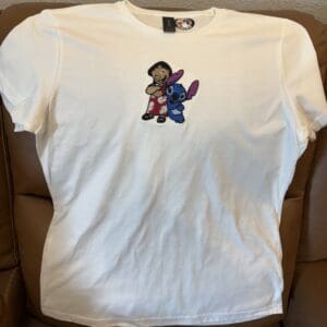 White t-shirt with cartoon characters design.